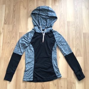 Black and grey hoodie with thumb holes.